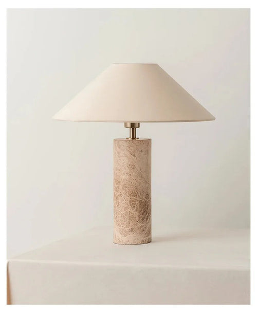 Marble Table lamp with a textured base on a light background
