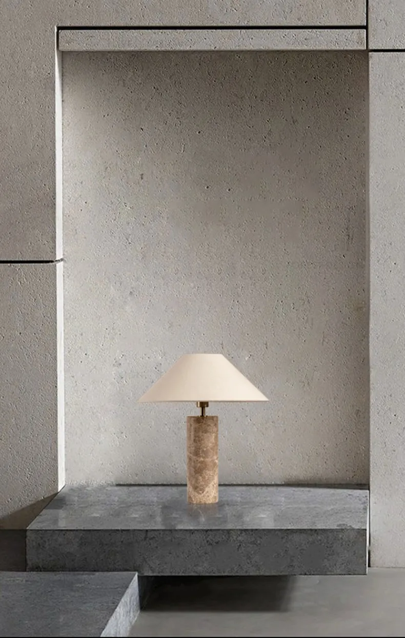 Modern lamp on a concrete surface with a concrete wall background