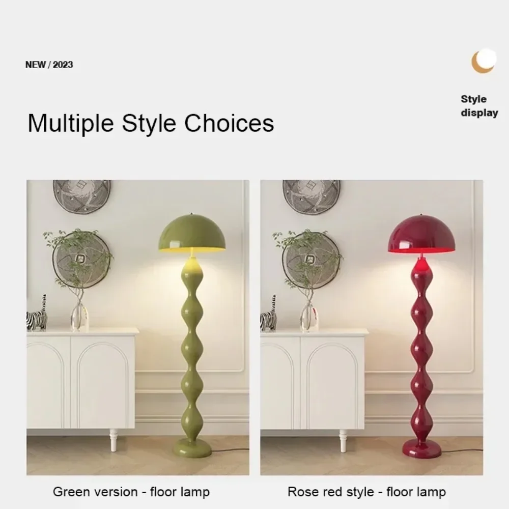 Two floor lamps, one green and one rose red, in a room setting with decorative elements.