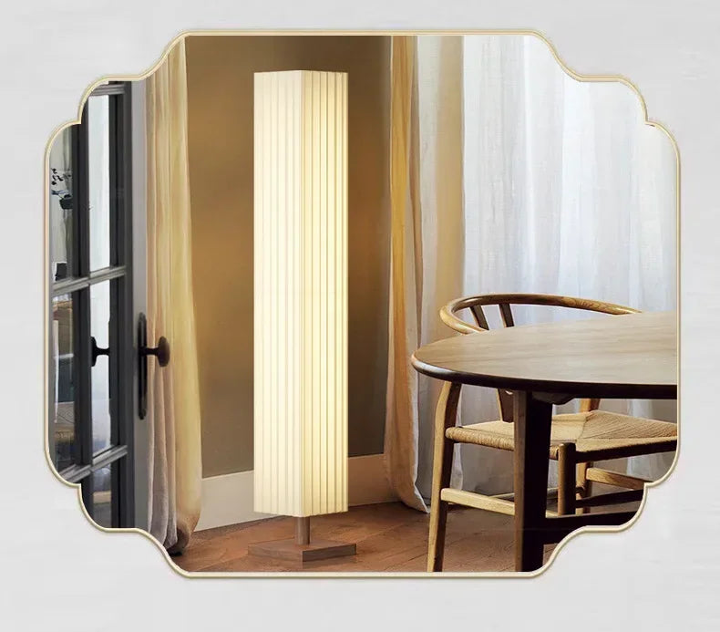 Modern interior design with a table and lamp, featuring traditional Chinese elements.