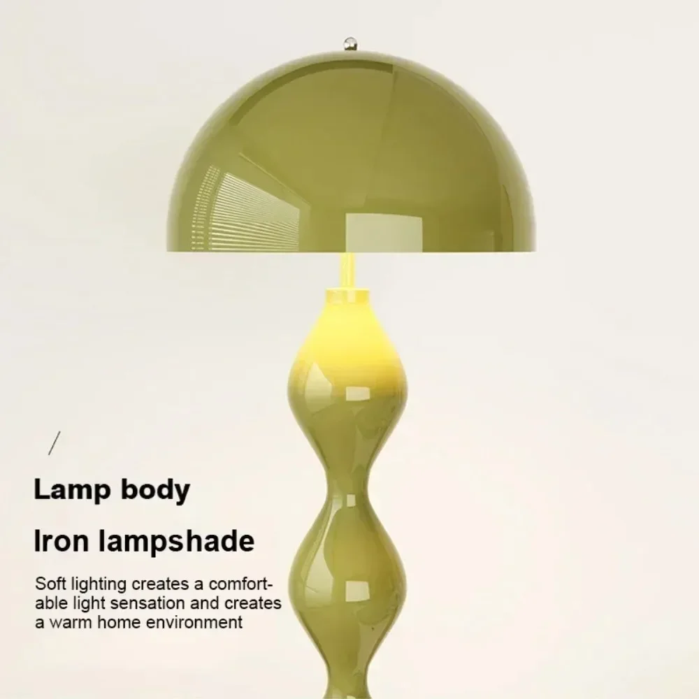 Green lamp with iron lampshade on a light gray background