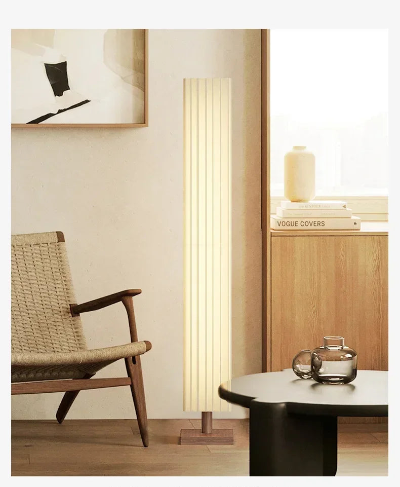 Modern interior design with a floor lamp, chair, and cabinet.