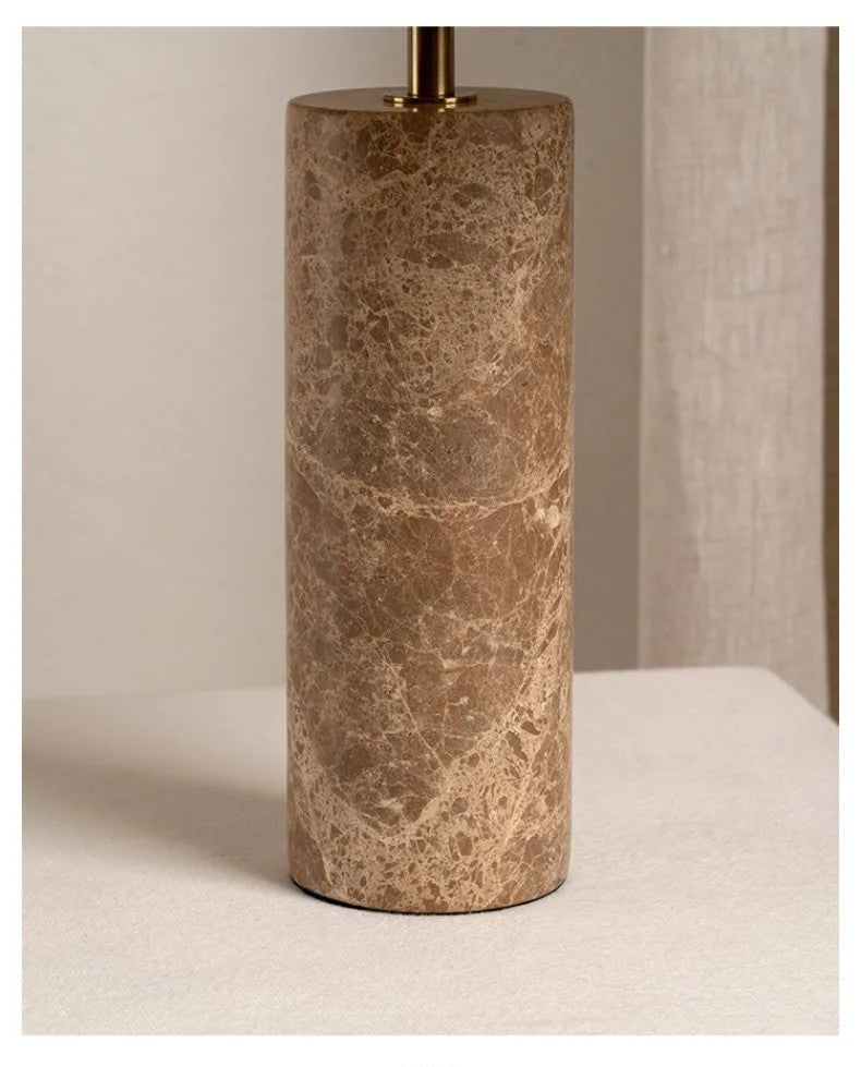 Marble-textured lamp base on a neutral background